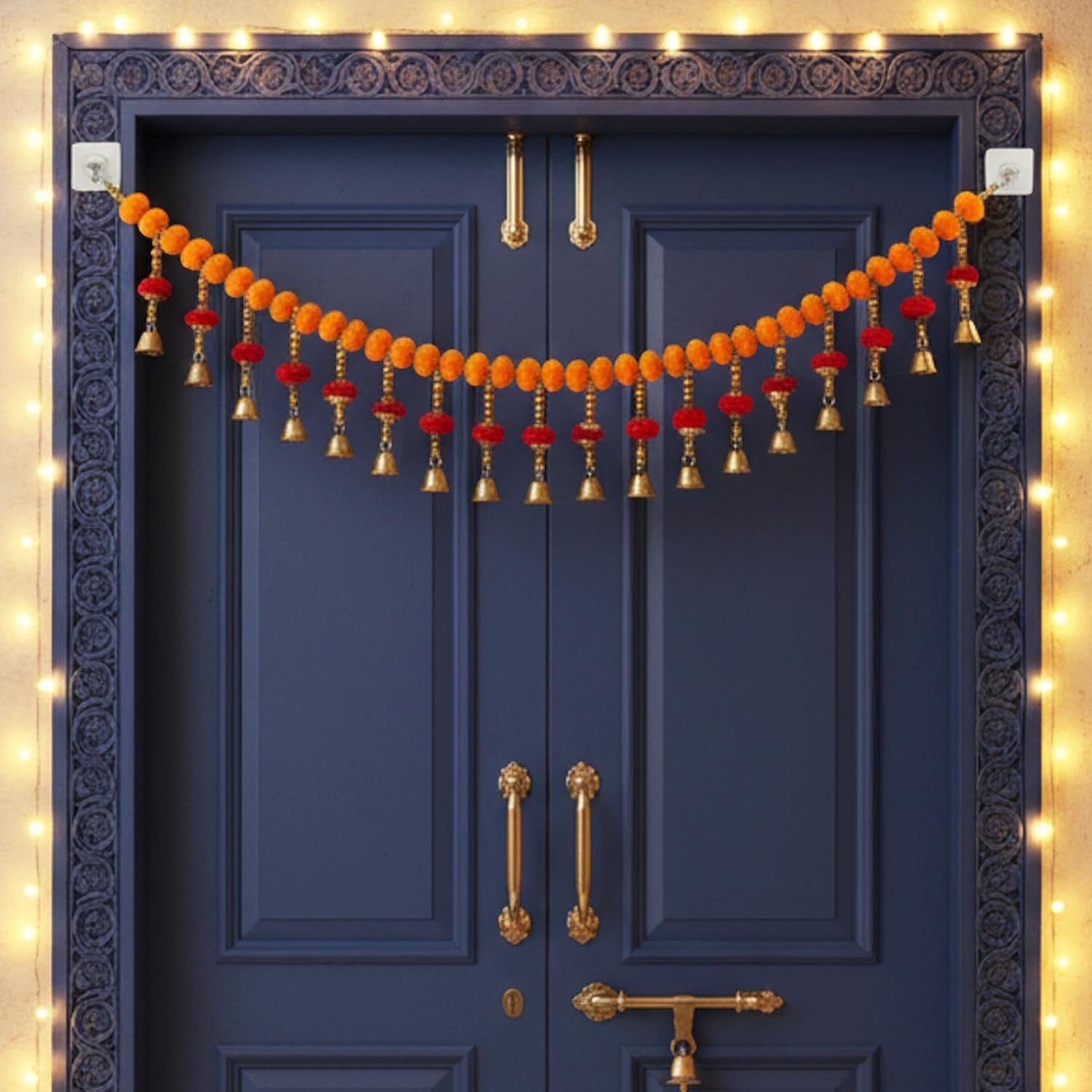 GoHooked orange and red artificial pom-pom toran with golden bells, 35 inches, for door decoration.