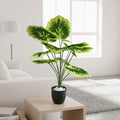 GoHooked Balfour Aralia artificial plant with 12 patterned green and yellow leaves in a speckled black pot with white pebbles.