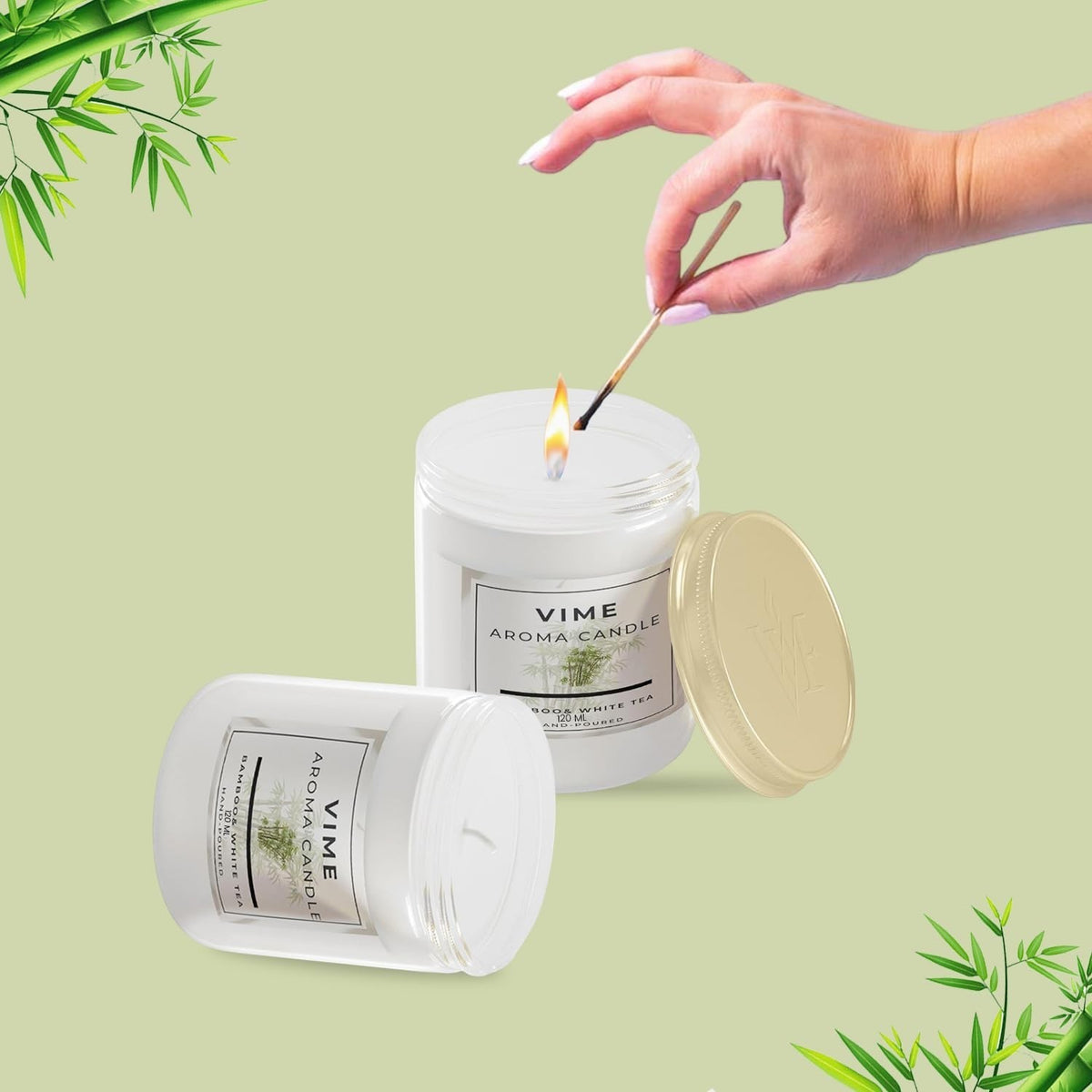 GoHooked Bamboo & White Tea scented candle in a white jar, lit by a match. 120 gm.
