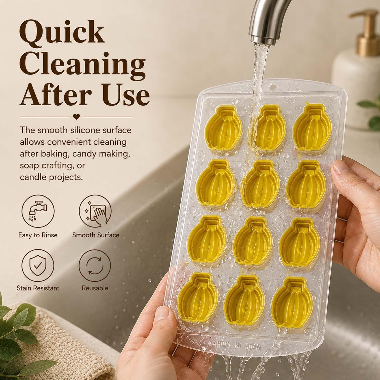 GoHooked 12-cavity yellow silicone banana-shaped chocolate mold being rinsed under a kitchen faucet