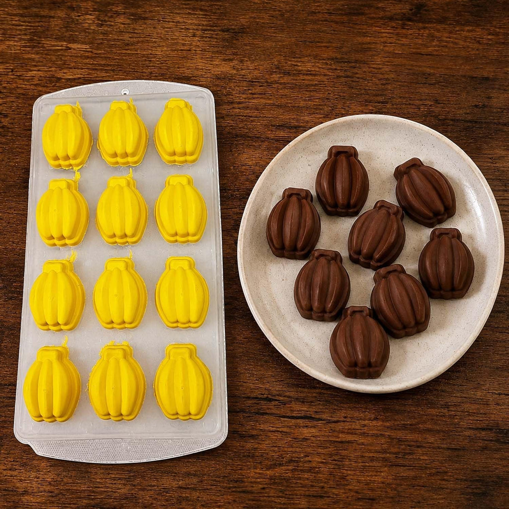 GoHooked 12-cavity yellow silicone banana-shaped chocolate mold with finished dark chocolate treats on a plate.
