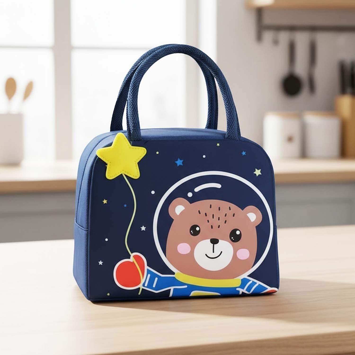 GoHooked navy blue insulated lunch bag with a cute bear in a spacesuit design, holding a yellow star balloon.