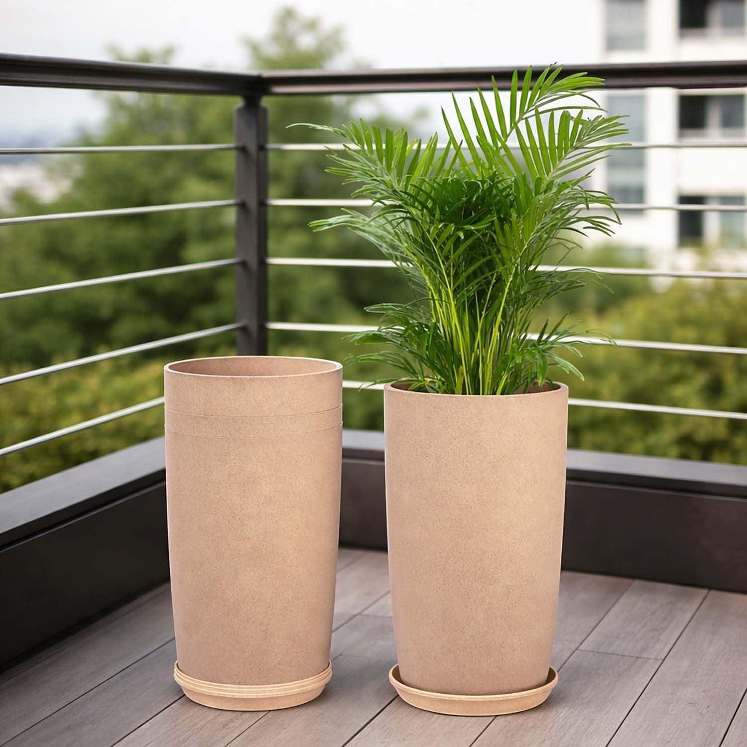 GoHooked set of 3 beige plastic garden planters with saucers, one holding a green palm plant.
