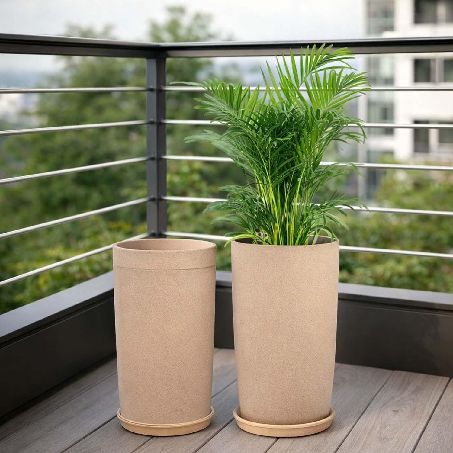 GoHooked set of 3 beige speckled plastic garden planters with saucers. One planter holds a green palm plant.