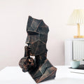 GoHooked BIANCO abstract geometric face statue in black copper finish, symbolizing 'Speak No Evil'. Modern polyresin decor.