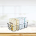 GoHooked Bianco black metal wire grid pantry organizer basket bin with handles, holding boxes of food.
