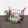 GoHooked Bianco black steel wire utility basket with curved handles, holding paint brushes, rollers, and wooden sticks.
