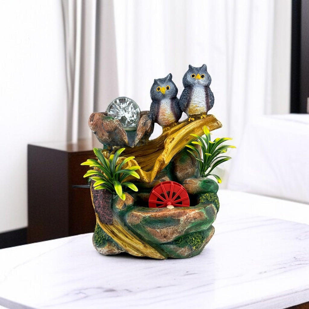 GoHooked BIANCO polyresin tabletop fountain with two owls, LED light, and red water wheel. Multicolour.