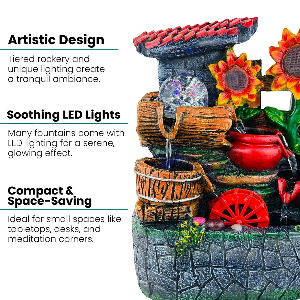 GoHooked BIANCO polyresin tabletop waterfall fountain with LED lights and sunflowers. Features tiered rockery, wooden buckets, and a red water wheel.