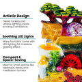 GoHooked BIANCO polyresin tabletop waterfall fountain with LED lights and adjustable speed control. Features tiered rockery, mushrooms, and a red water wheel.