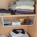 GoHooked Bianco silver metal undershelf storage basket pack of 2, with iron construction and open grid design. Holds folded clothes, wallet, and belt.