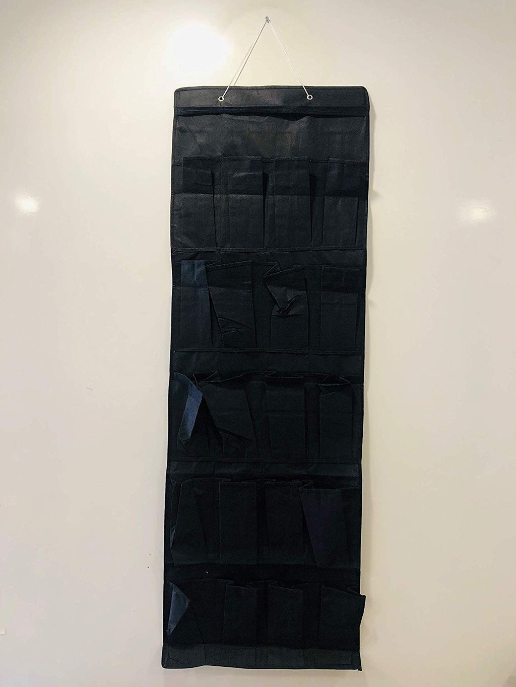 Go Hooked black non-woven fabric over-the-door organizer with 20 pockets for shoes and accessories.