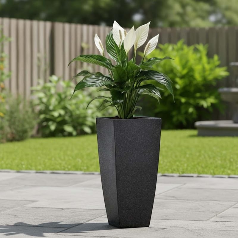 GoHooked black 24-inch tall tapered polymer planter with white peace lily plant. Outdoor garden decor.