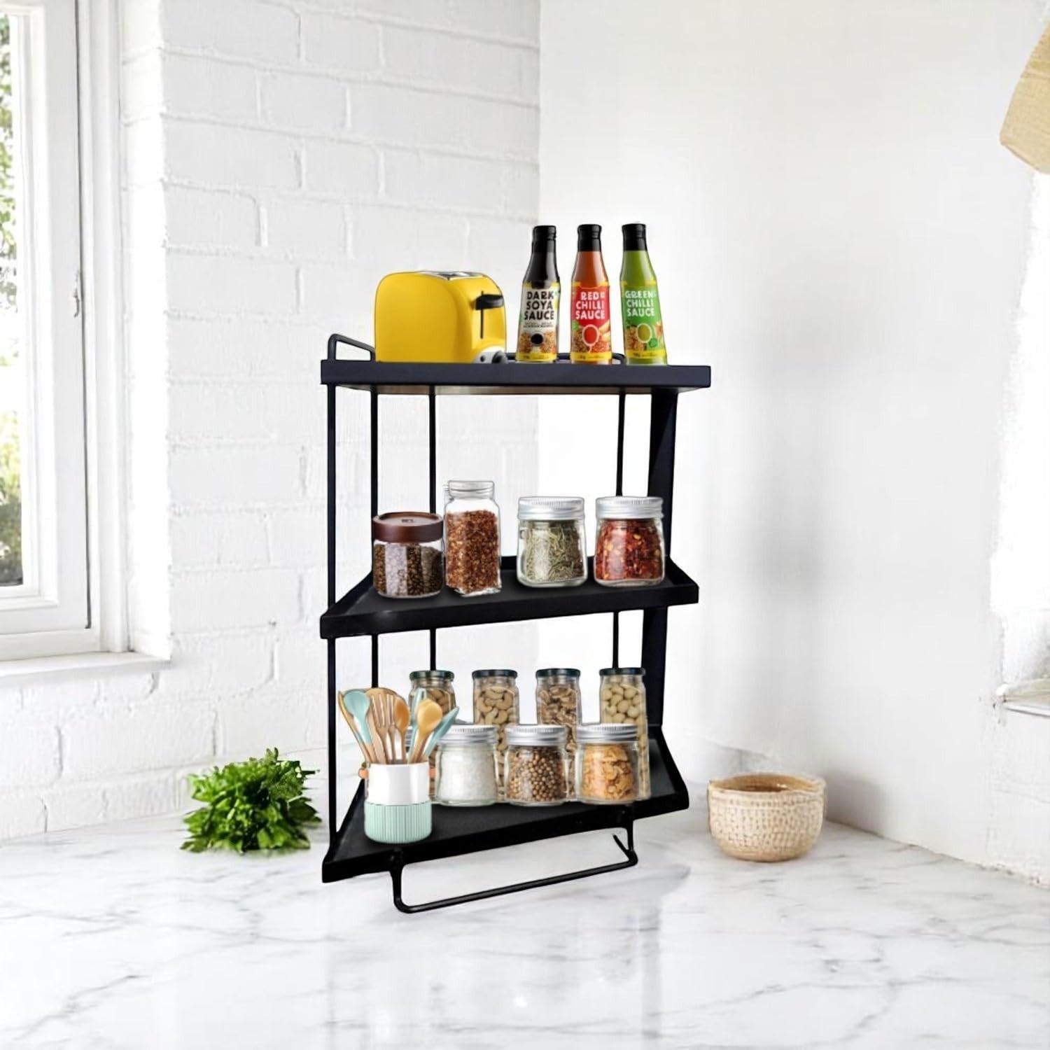GoHooked black 3-tier iron countertop storage organizer rack with spices, jars, and a yellow toaster.