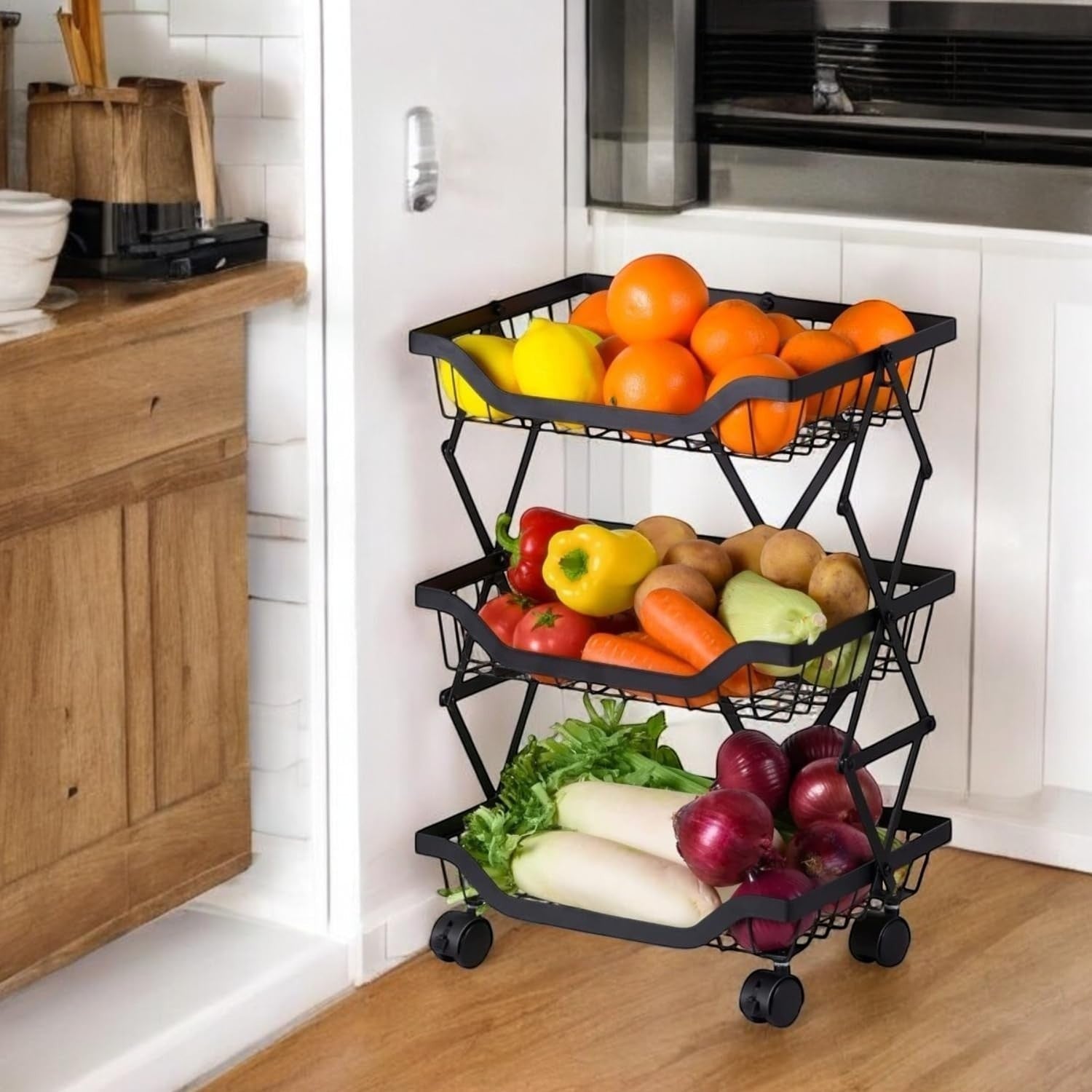 GoHooked black 3-tier foldable metal rolling storage basket filled with fruits and vegetables, on wheels.