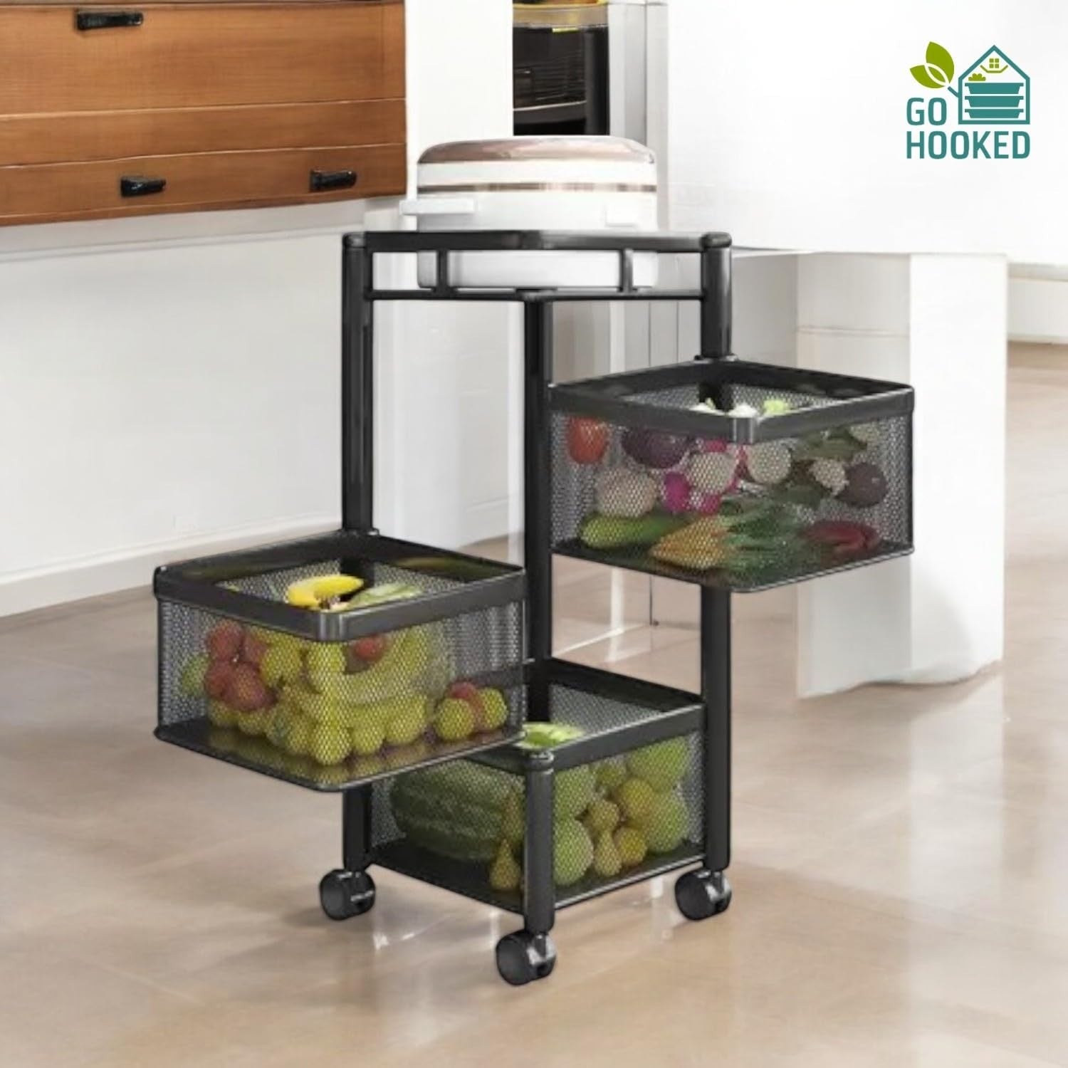 Go Hooked black 3-tier rotating mesh storage trolley filled with fruits and vegetables.