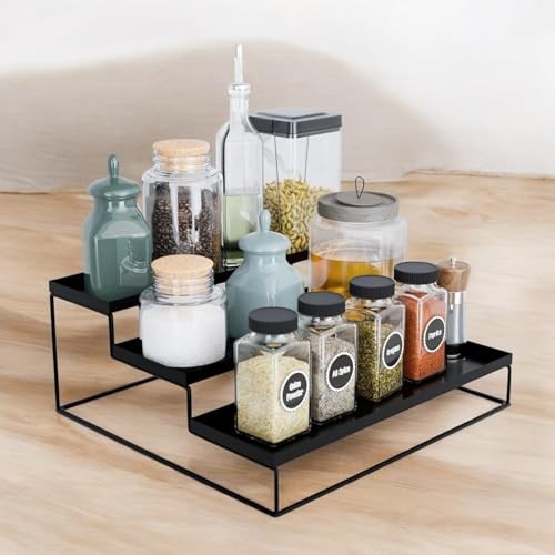 GoHooked black 3-tier step spice rack organizer made of powder-coated iron, holding various jars and bottles.