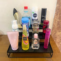 GoHooked black 3-tier metal step rack organizer holding various bottles and containers, ideal for spices or bathroom items.
