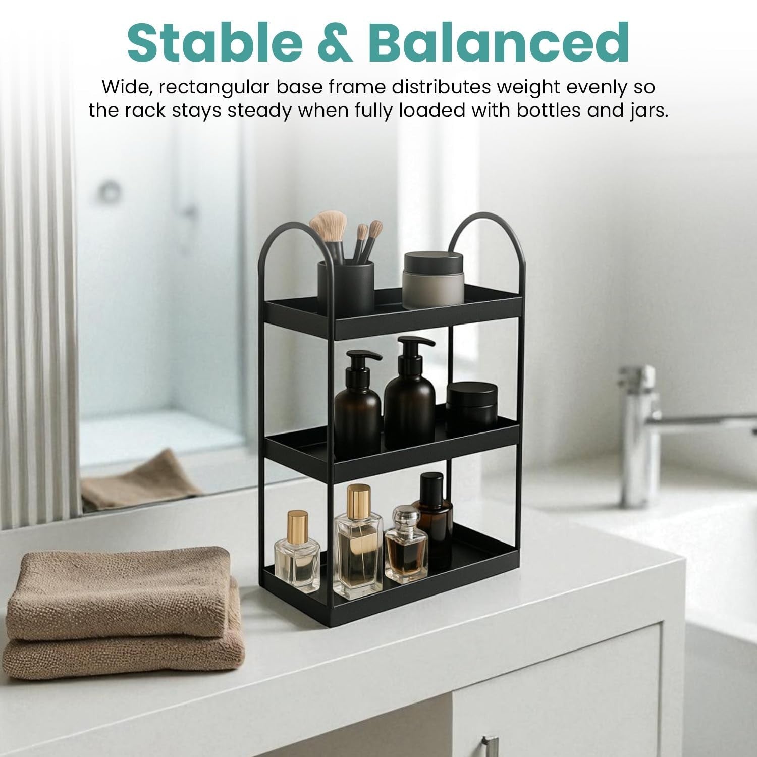 Go Hooked black 3-tier curved metal vanity organizer with bottles, jars, and brushes on a bathroom counter.