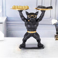 GoHooked black polyresin bulldog statue with gold sunglasses and belt, holding two gold serving trays.