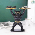Go Hooked black polyresin bulldog statue holding two gold serving trays, wearing sunglasses and a gold belt.