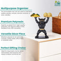 Go Hooked black polyresin bulldog statue with gold accents holding two serving trays, one with snacks and one with candies.