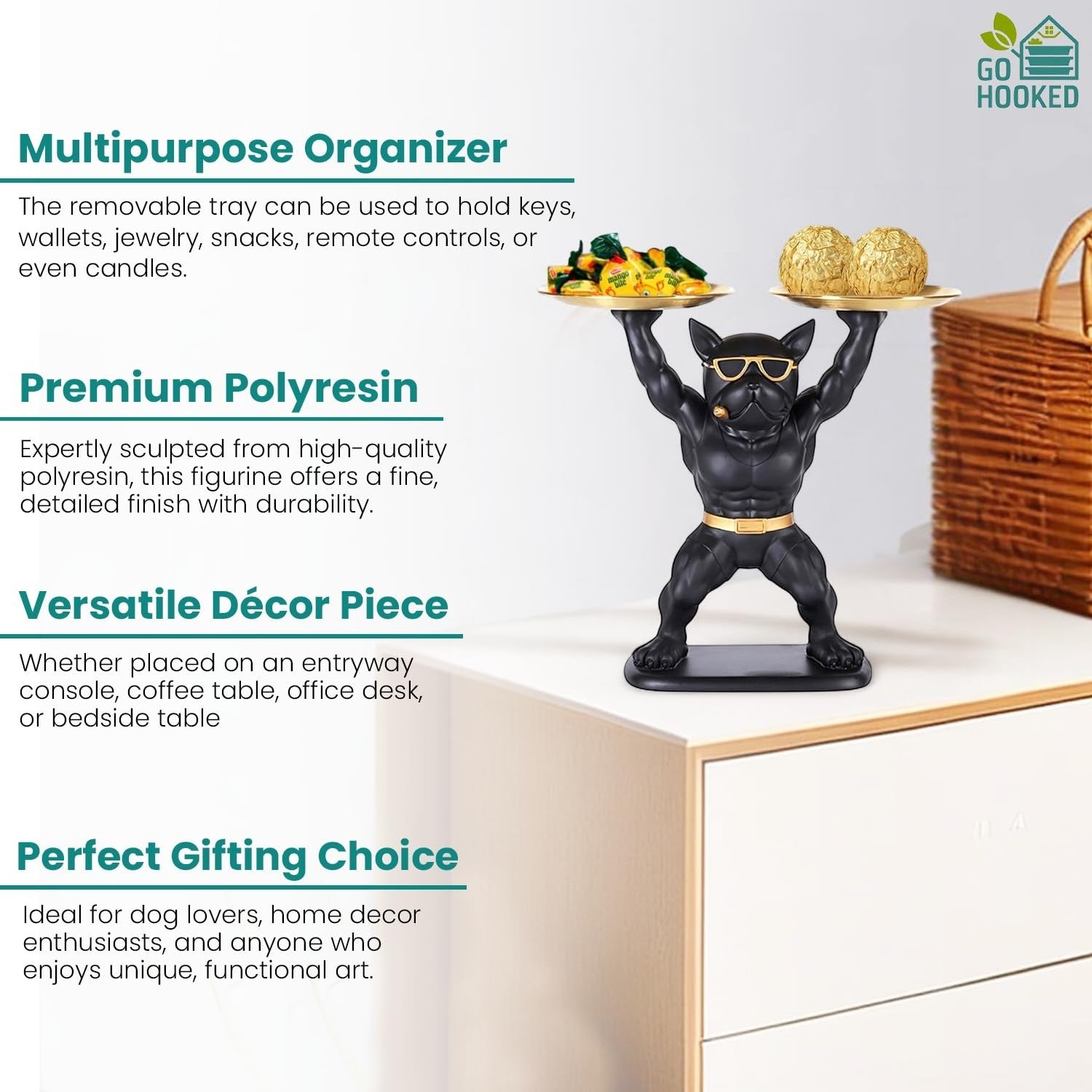 Go Hooked black polyresin bulldog statue with gold accents holding two serving trays, one with snacks and one with candies.