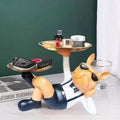 GoHooked black polyresin bulldog statue with sunglasses holding two gold serving trays. Ideal for home decor.