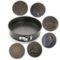 GoHooked black carbon steel round cake pan with removable bottom and 6 decorative inserts: teddy bear, hearts, cake, Santa, bunny, and textured circle.