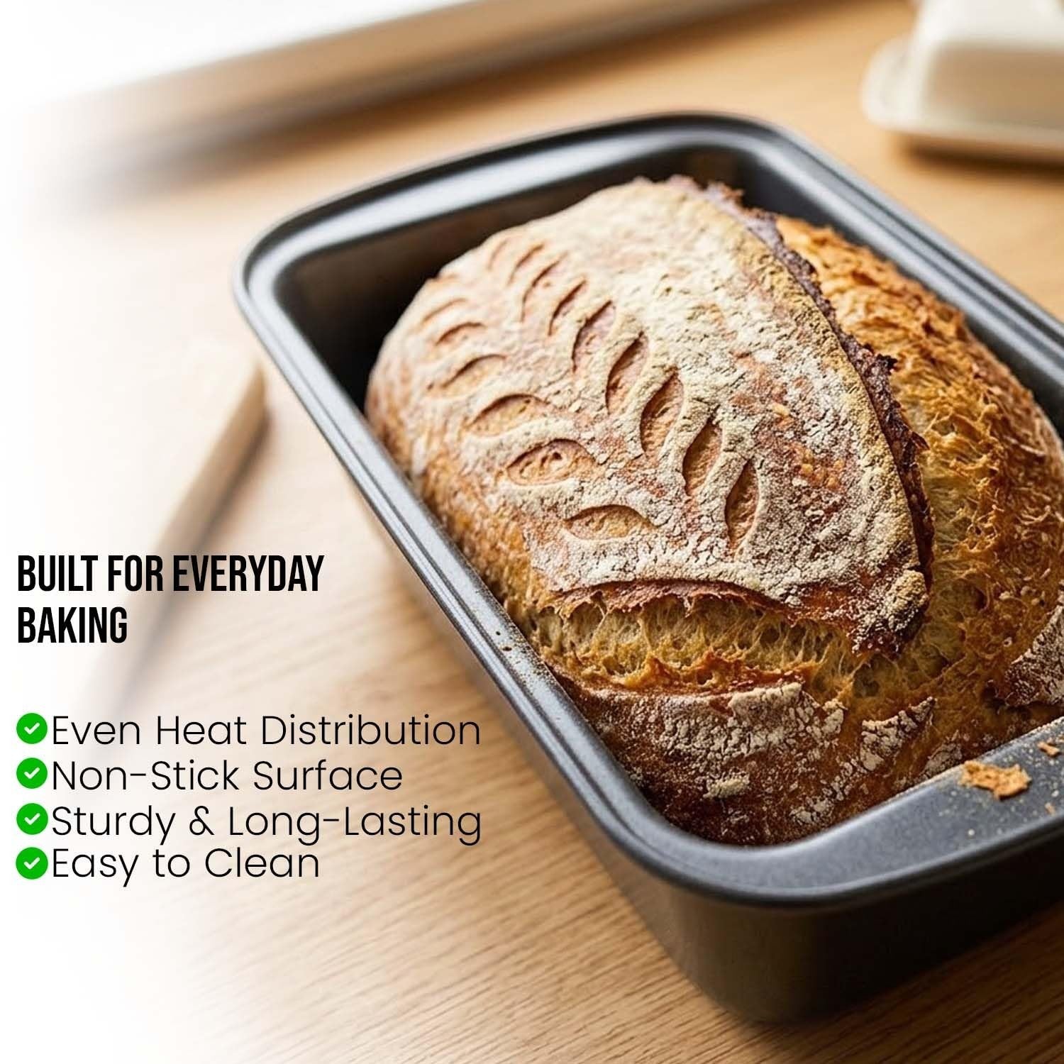 GoHooked black carbon steel loaf pan with a freshly baked loaf of bread inside, featuring a non-stick surface.