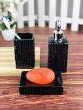GoHooked black ceramic 3-piece bathroom set with textured design, includes soap dish, toothbrush holder, and dispenser.
