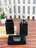 GoHooked black ceramic 3-piece bathroom set with textured design, includes soap dispenser, toothbrush holder, and soap dish.