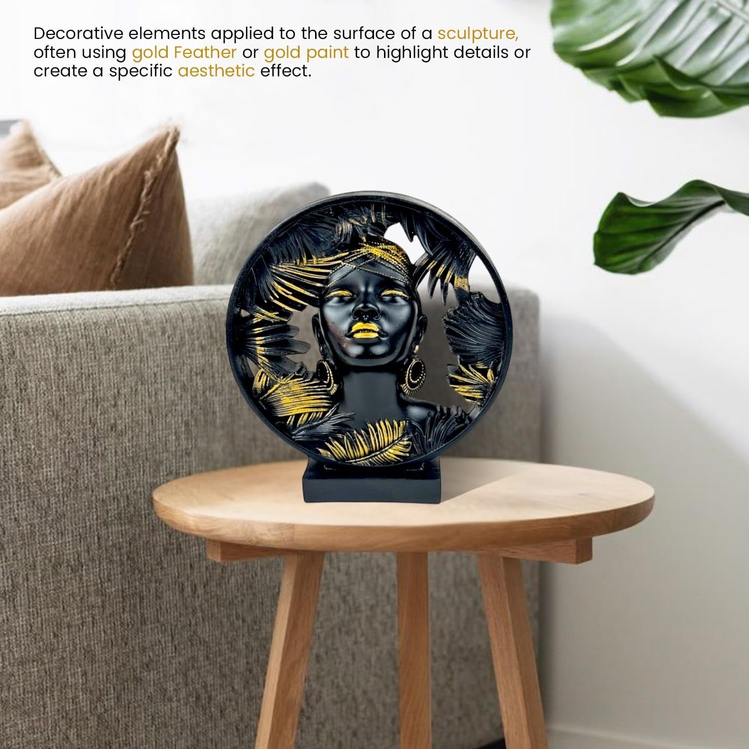 GoHooked black and gold polyresin bust statue of an African lady framed by palm leaves, 22 cm.