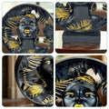 GoHooked black and gold polyresin African lady bust statue with palm leaf details. Luxury home decor.