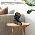 GoHooked black and gold tribal leaf African woman bust figurine with braided headwrap and large hoop earrings.