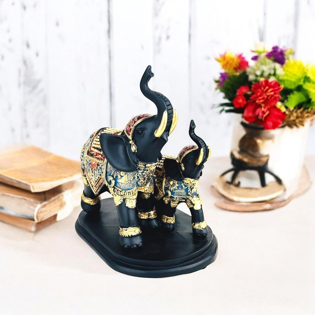 GoHooked black and gold polyresin elephant figurine with intricate royal embellishments, trunk up for good luck.