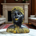 GoHooked black and gold tribal leaf African woman bust figurine with beaded headwrap and large earrings.