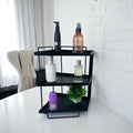 GoHooked black 3-tier iron countertop organizer rack with toiletries and a small plant.