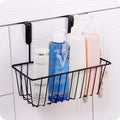 GoHooked black iron over-the-door hanging basket organizer holding bottles of lotion and toner.