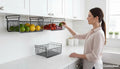GoHooked black powder coated iron under shelf basket set of 3, holding fruits and vegetables. Space-saving kitchen storage.
