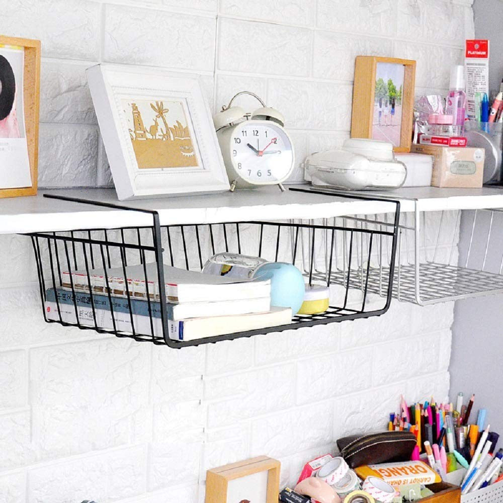 Go Hooked black powder-coated iron under shelf basket with books and jars. Space-saving storage solution.