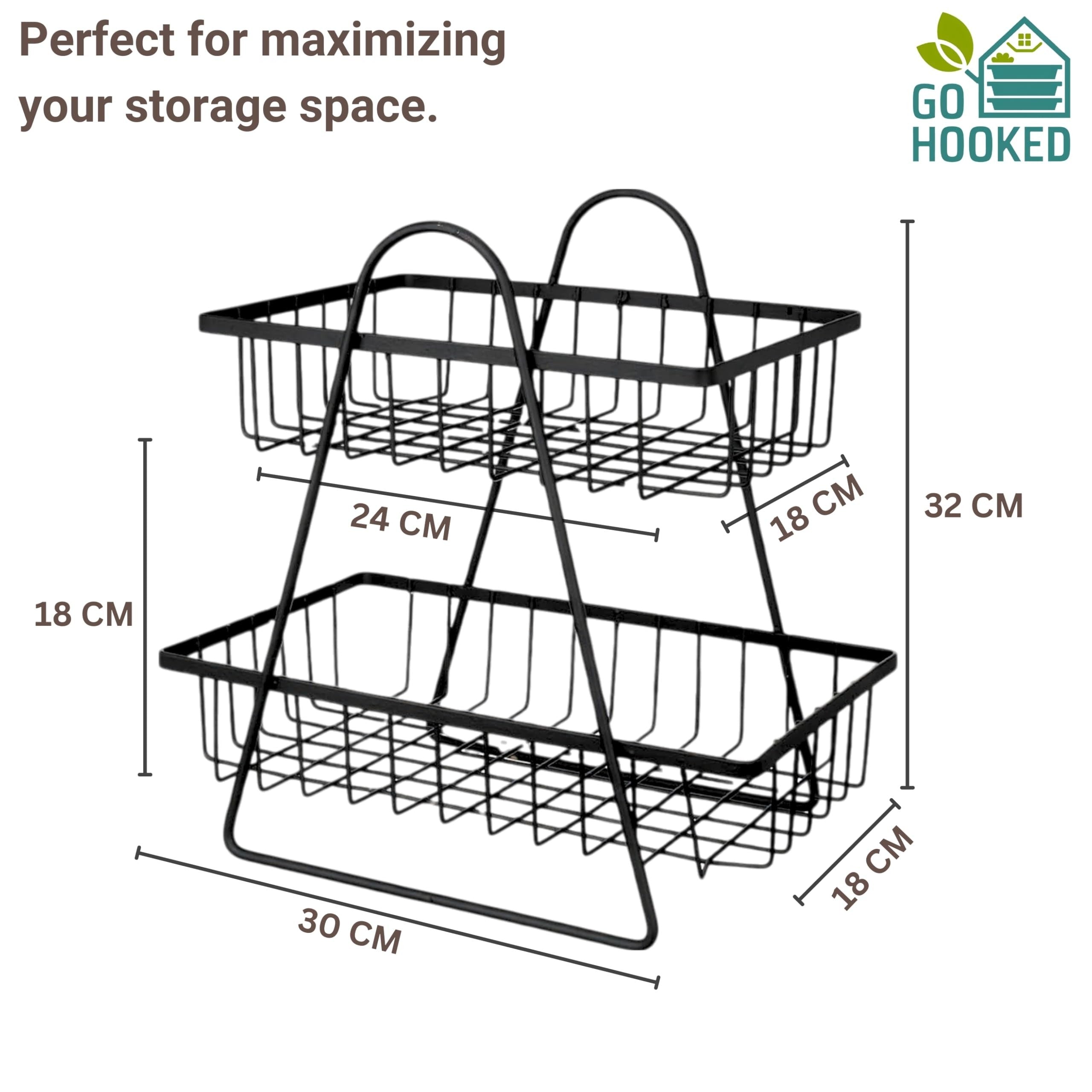 GoHooked black metal 2-tier fruit basket with open wire design for kitchen countertop storage. Dimensions: 32cm H x 30cm W x 18cm D.