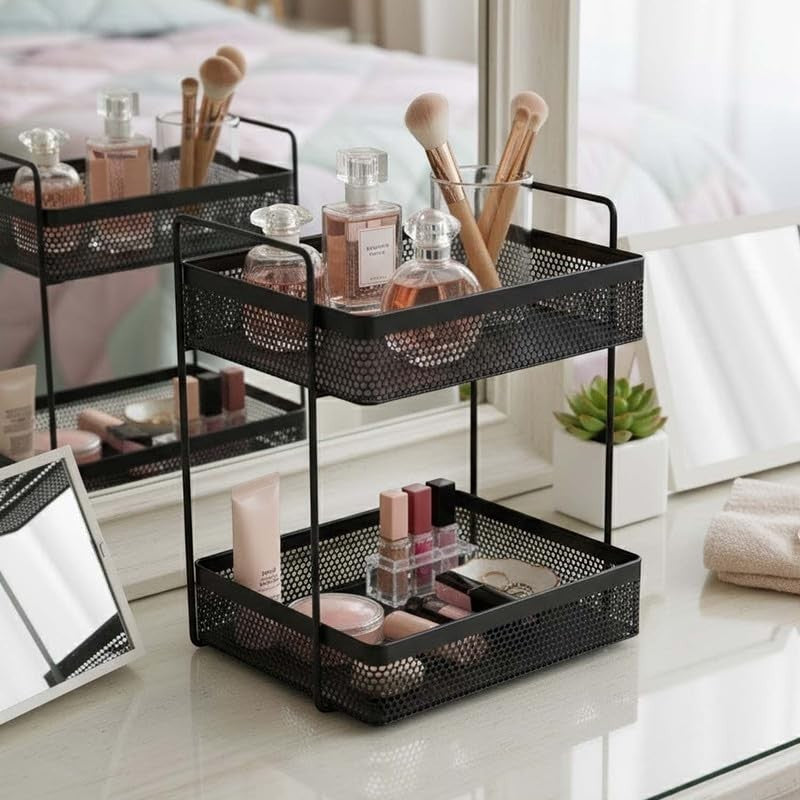 GoHooked black metal 2-tier standing rack organizer holding perfumes, makeup brushes, and cosmetics on a vanity.