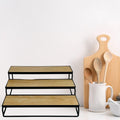 GoHooked black metal 3-tier shelf organizer with wood-look shelves for spices or cosmetics.