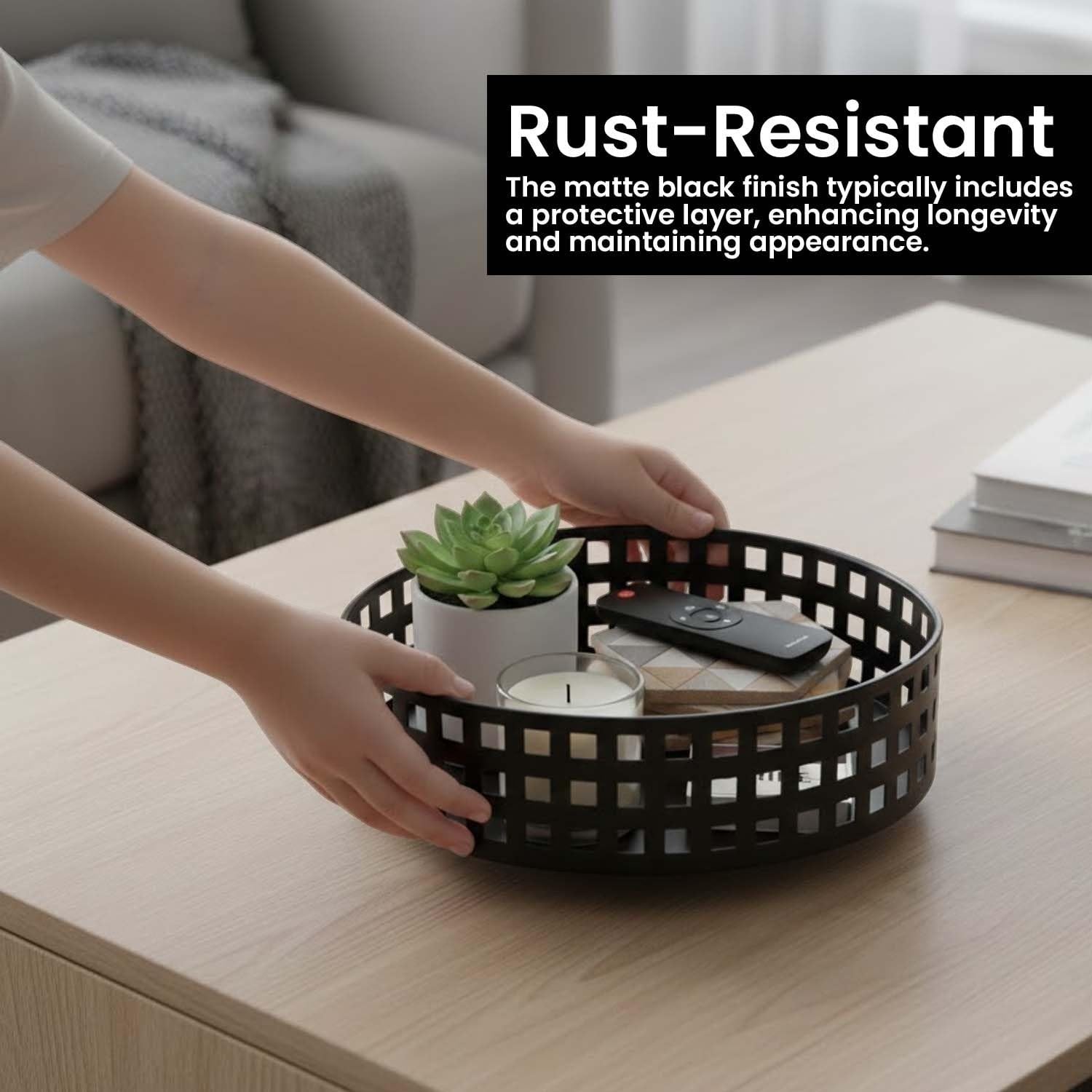 Go Hooked black metal revolving fruit basket with a grid pattern, holding a plant, candle, and remote.