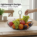GoHooked black metal wire fruit basket with detachable wooden handle, filled with apples, oranges, grapes, and plums.
