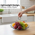 Go Hooked black metal fruit basket with detachable wooden bead handle, filled with fruits on a wooden table.