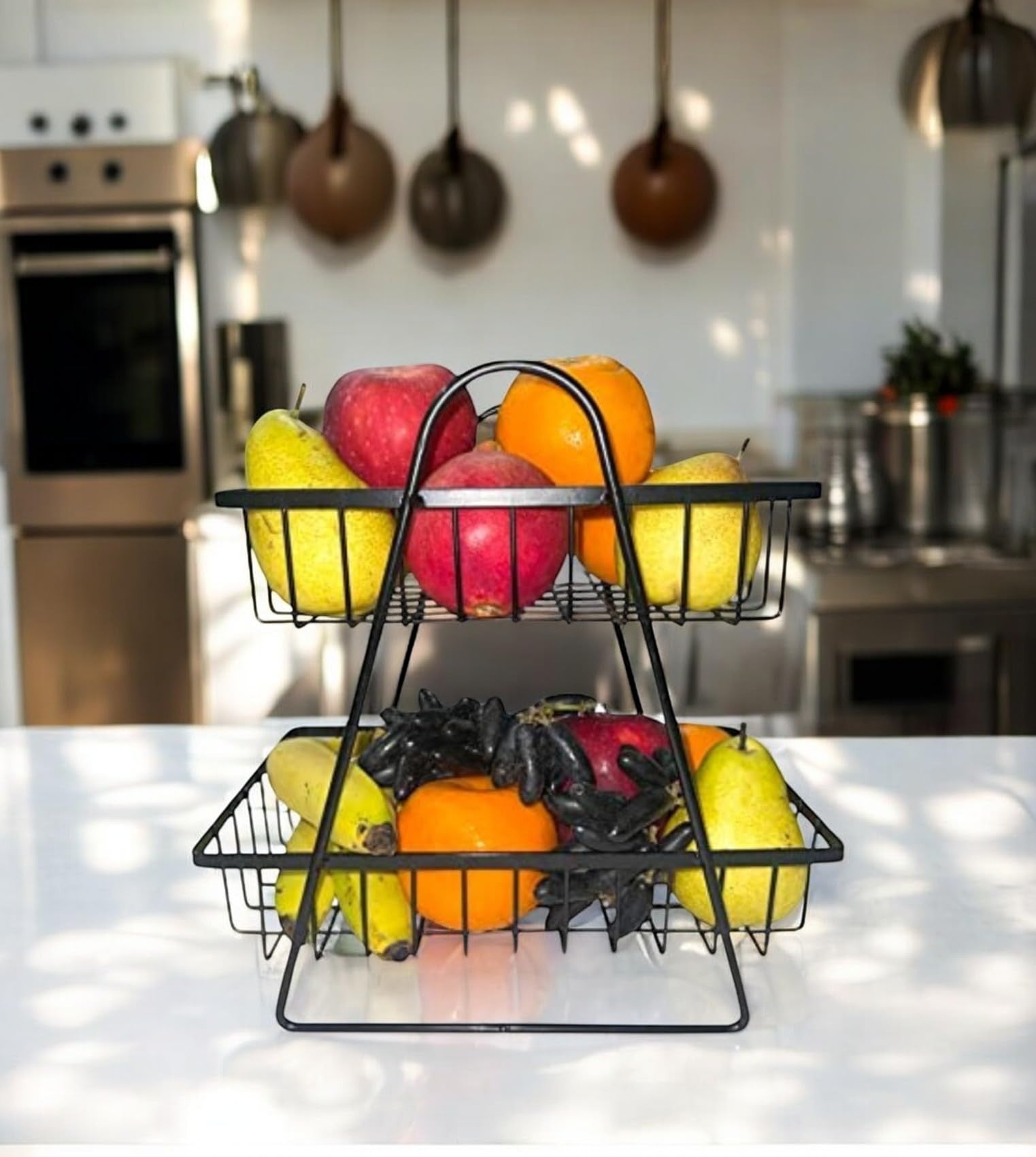 Go Hooked black metal 2-tier fruit basket with wooden handle, perfect for kitchen counter storage of fruits and vegetables.