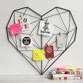 GoHooked black metal heart-shaped geometric wall grid with shelf, displaying inspirational quotes and photos.