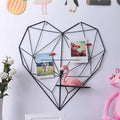 GoHooked black metal heart-shaped wall photo grid with shelf, ideal for displaying memories and Valentine's Day decor.